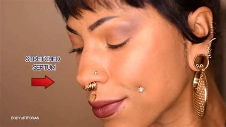 How do you remove a captive bead ring from a septum piercing?