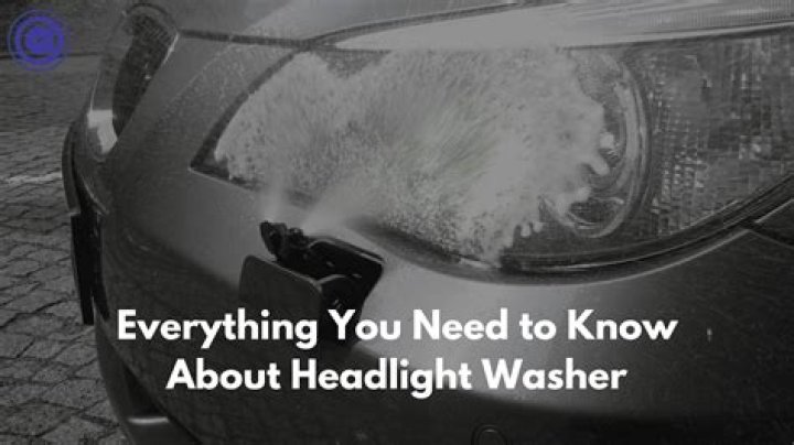 How do you turn on the headlight washer on a Volvo?