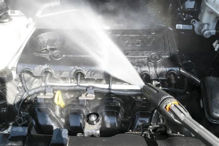 Is it safe to spray your engine with water?