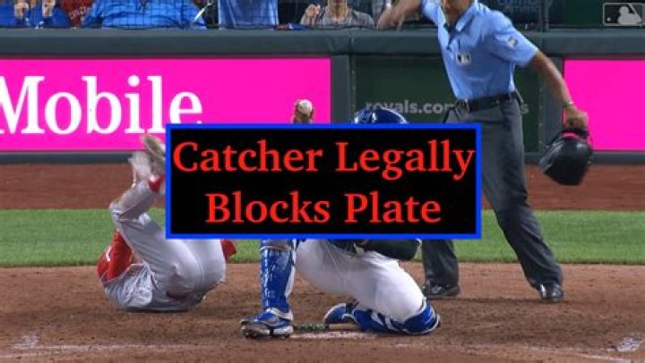 Is the catcher allowed to block home plate?