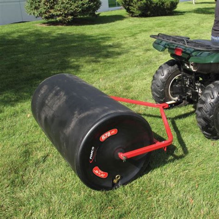 Should I fill my lawn roller with sand or water?