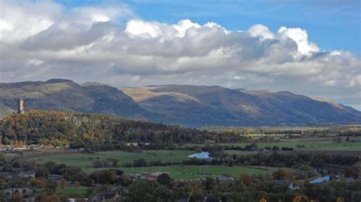 What do lowlands and mountains symbolize in A Farewell to Arms?