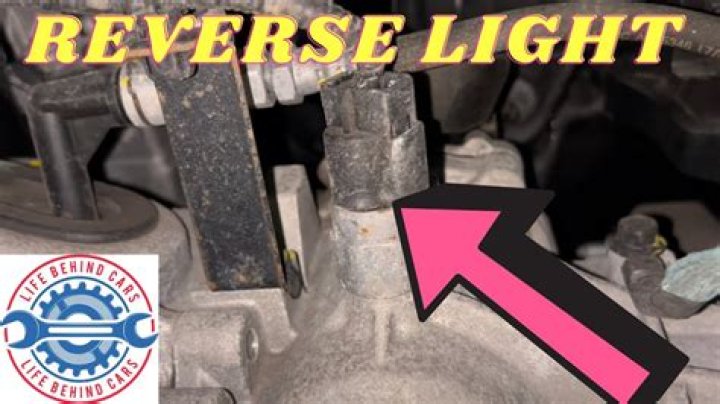 Where is the reverse light switch located?